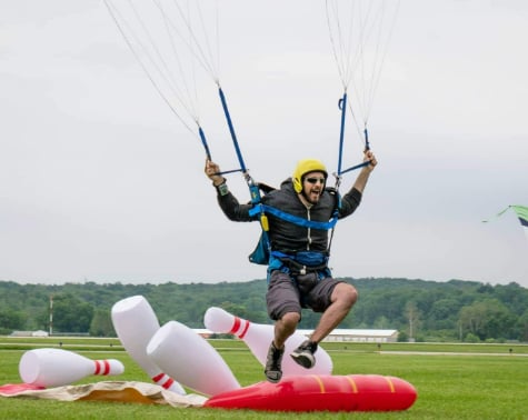 Jeff, a NovaCare patient, coming in for landing on his parachute. 